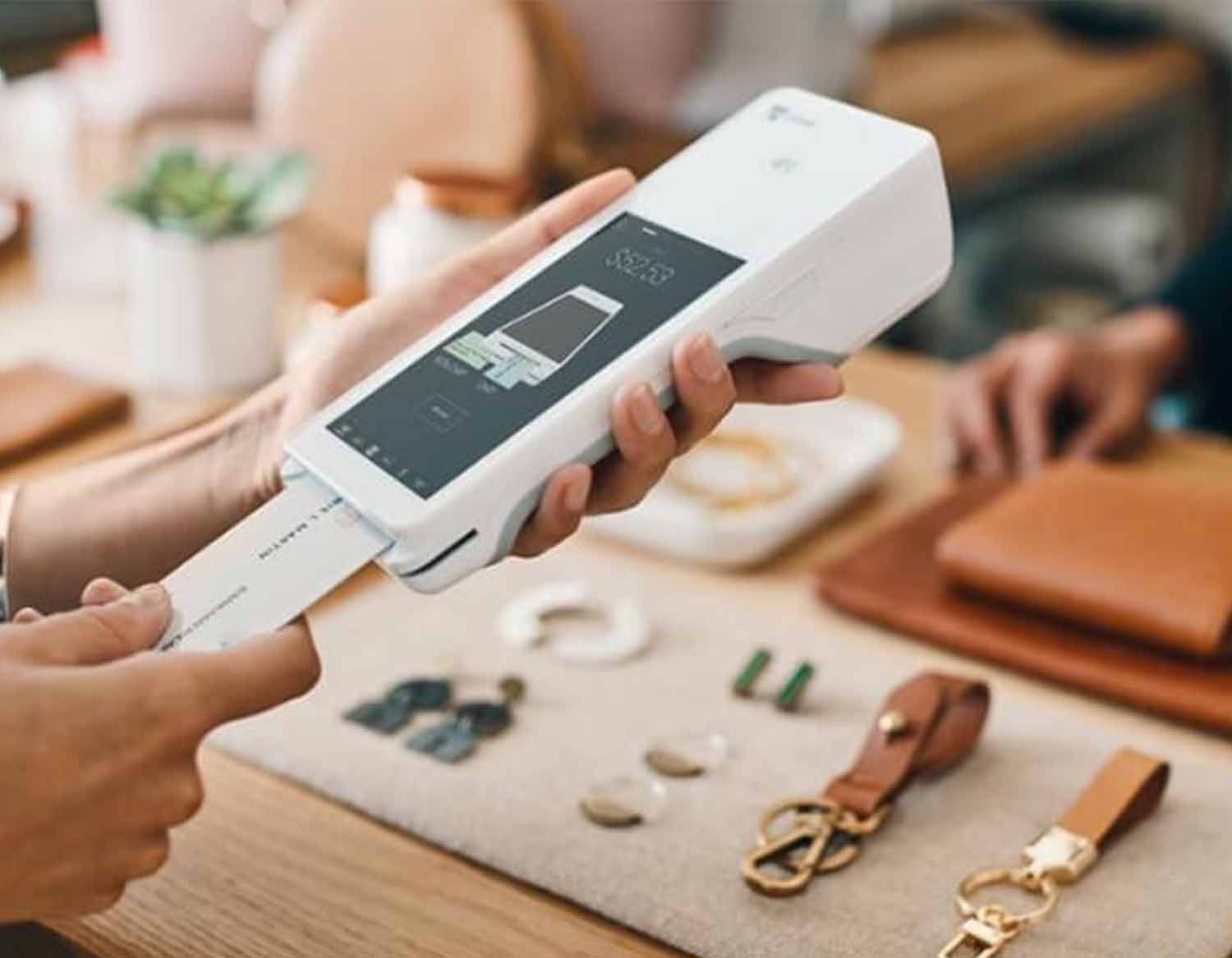 man processing a credit card with a clover flex